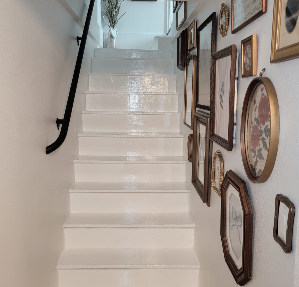 Farm stairwell. Farmhouse reno. DIY paint project. Gallery walls. Stairwell update