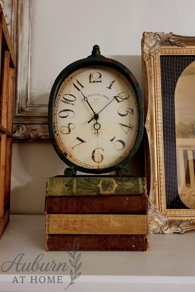Vintage book display. Farmhouse clock. DIY cabinet reno.