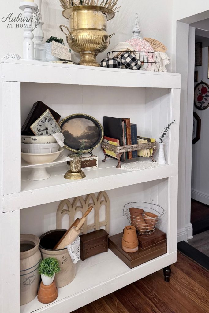 Farmhouse shelf with vintage crocks, mixed metals and vintage books