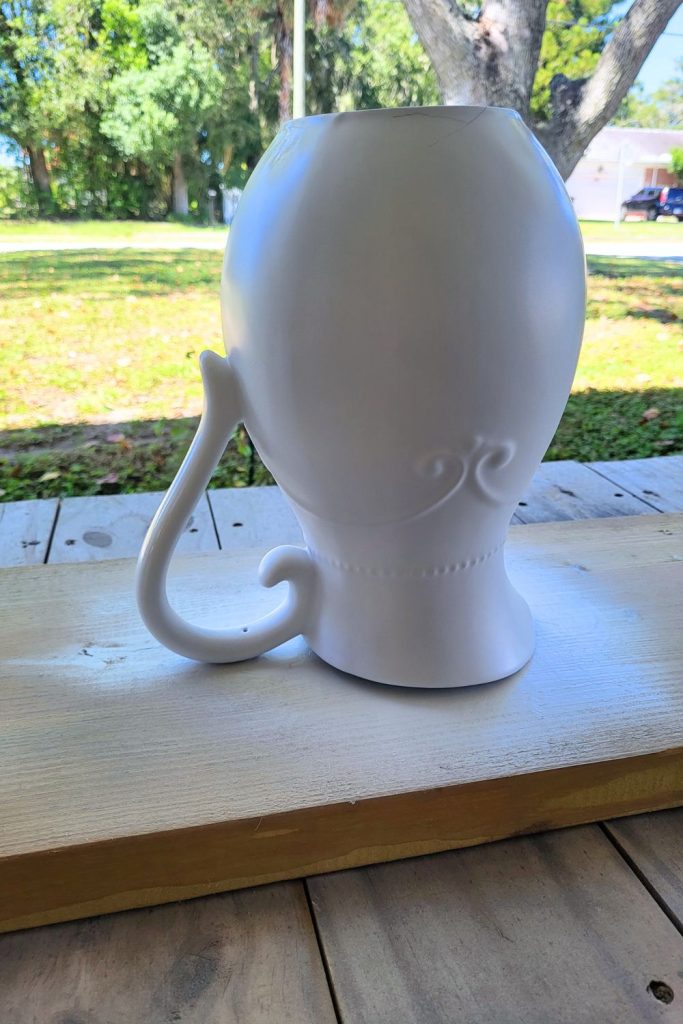 Farmhouse Pitcher makeover. Painting with spray paint to update dated pitcher