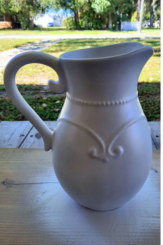 Pitcher farmhouse makeover. Spray painting white