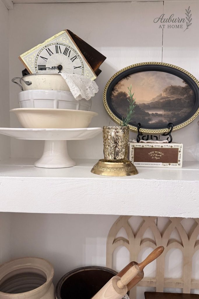Farmhouse shelf with vintage decor and clock face