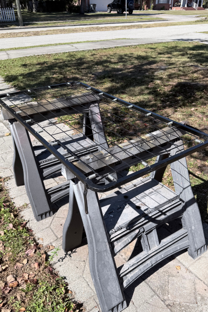 Old metal crib spring before being cleaned and painted for DIY wall accent