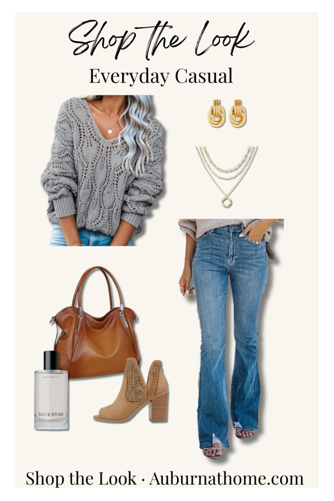 Everyday casual outfit collage featuring a grey oversized knit sweater, layered gold necklaces and earrings, medium-wash flare jeans, tan ankle boots, brown leather handbag, and perfume bottle arranged on a cream background. Shop the Look – AuburnAtHome.com.