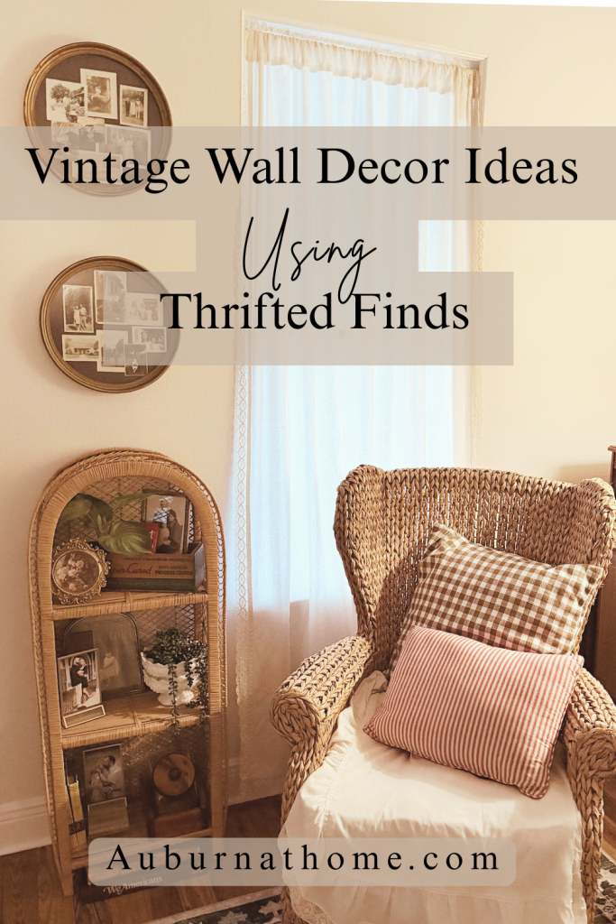 Vintage wall decor featuring thrifted frames and repurposed crewel embroidery styled in a cozy living room